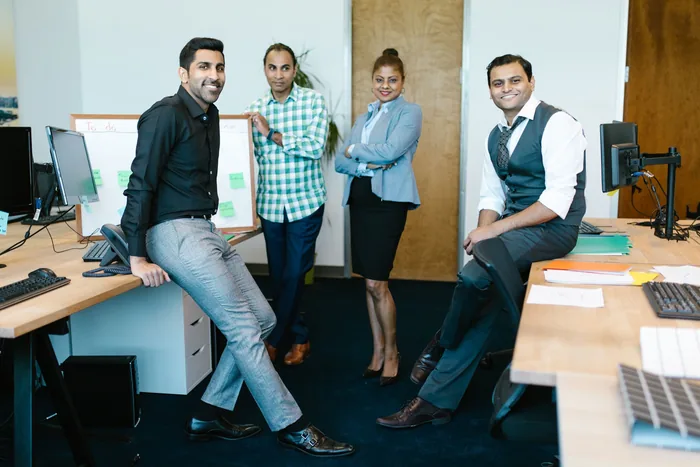 Team photographed together in their office