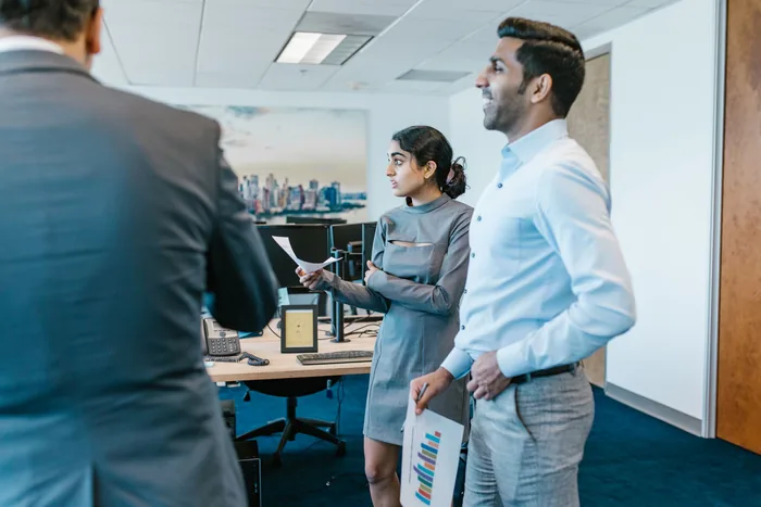 Colleagues at work in the office during a normal working day