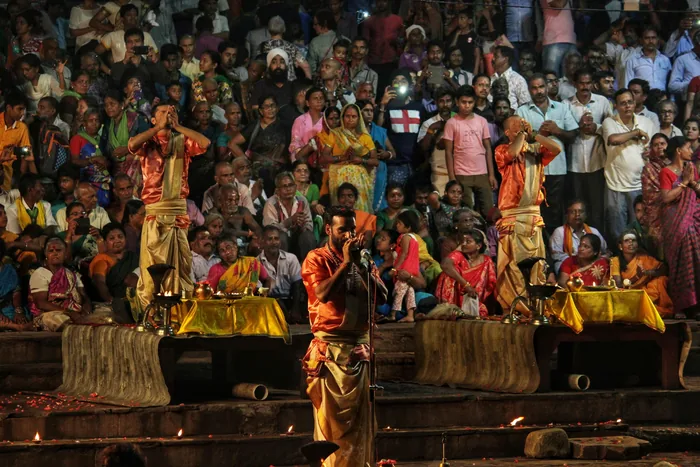 Audience filling the ground at a community performance