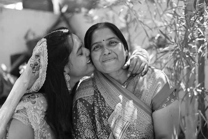 Mother and daughter photographed together in black and white