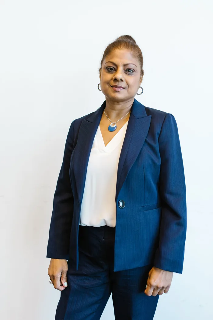 Headshot of a woman against a plain background for a company website