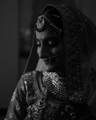Black and white portrait of the bride in full bridal jewellery